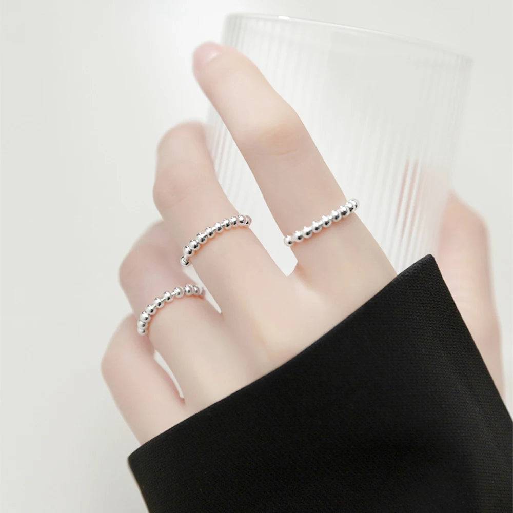 Sormus stressinlievitykseen ja pyörivillä helmillä miehille tai naisille hopea