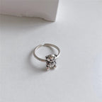 Retro Hopeasormus Karhu