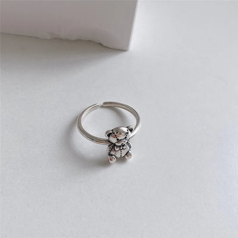 Retro Hopeasormus Karhu