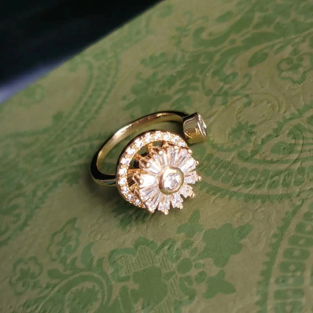 Naisten kultainen pyörivä stressinpoistorengas