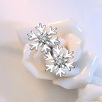 Korvakorut lumihiutalekorut zirkonilla