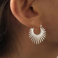 Boucles d'oreilles créoles demi-soleil argentées