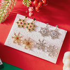 Riipuvat korvakorut lumihiutaleella