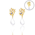 Koralliset roikkuvat korvakorut helmellä ja sinisellä zirkonilla