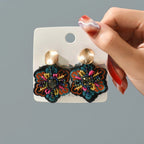 Värikkäät kukkaiset roikkuvat korvakorut 