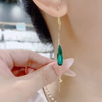 Riipuvat vesipisaran muotoiset korvakorut vihreällä zirkonilla