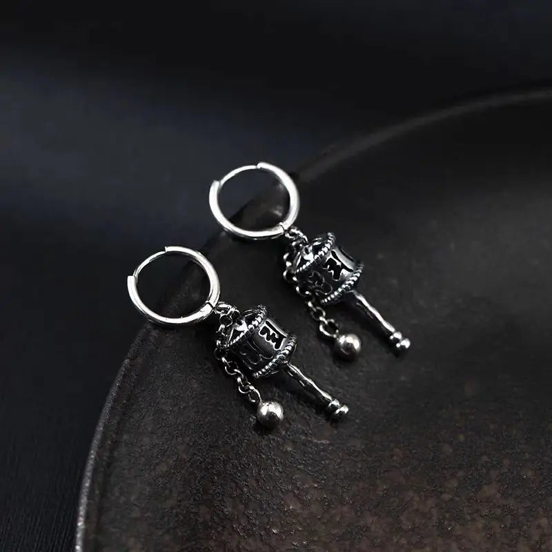 Riipuskorvakorut, buddhalainen rukouspyörä