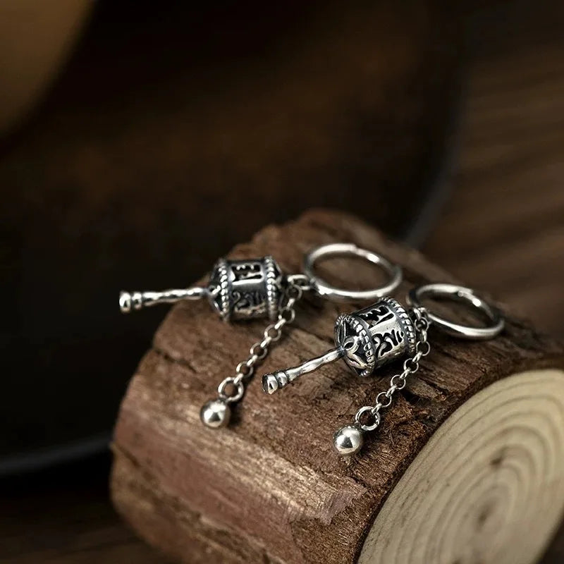 Riipuskorvakorut, buddhalainen rukouspyörä