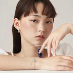 Rannekoru jossa kuukivihelmi ja zirkonium-tähtikoristeet