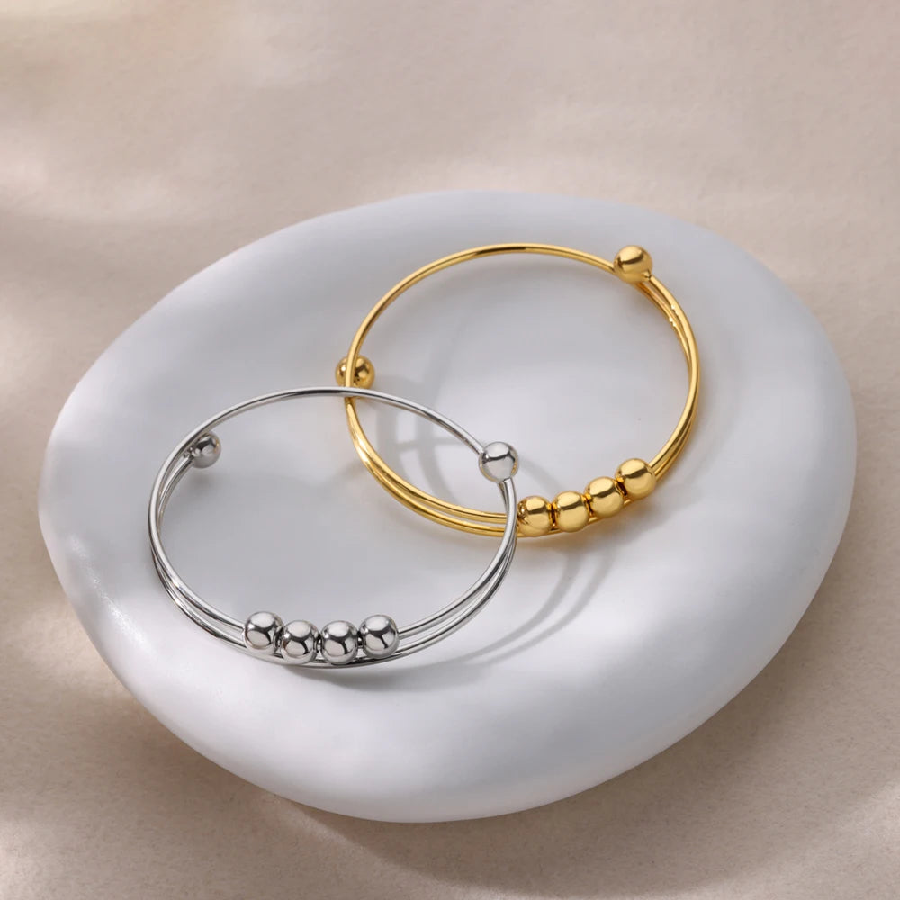 Rannekoru pyörivillä helmiillä stressinlievitykseen miehille tai naisille hopea