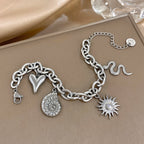 Rannekoru auringolla ja simpukoilla miehille tai naisille hopea