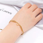 Sydän- ja enkelinsiipirannekoru kultainen