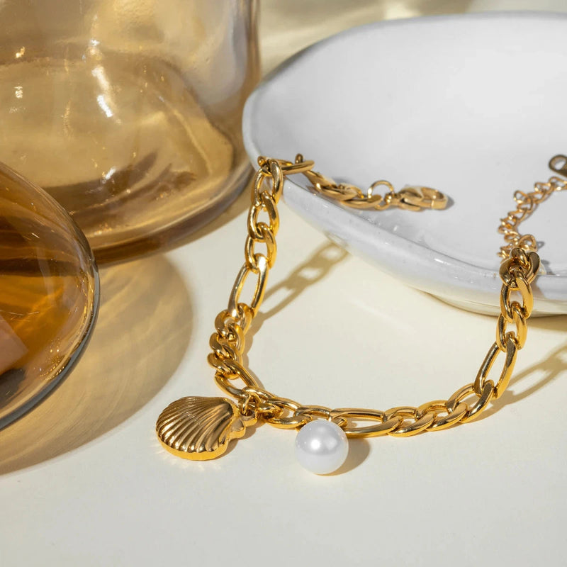 Naisten kampasimpukka- ja helmirannekoru