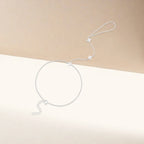 Käsirannekoru, jossa on hopeiset zirkoniakukat