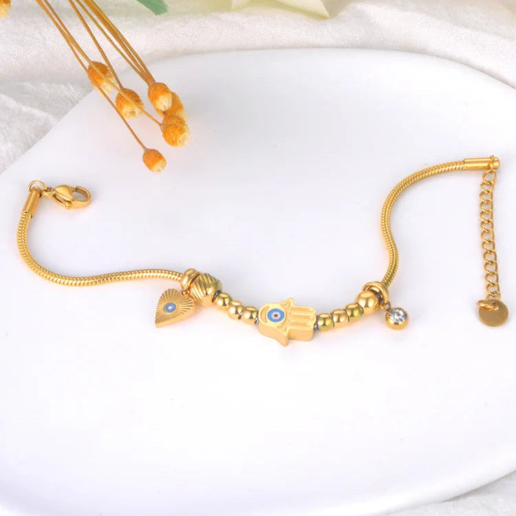 Suojaava rannekoru Fatman kädellä ja sinisellä silmällä kulta