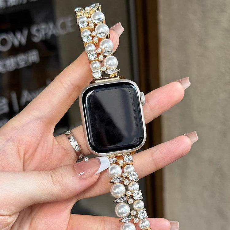 Korvaava ranneke Apple Watchille, jossa on strasseja ja kultaisia helmiä sekä helmiä