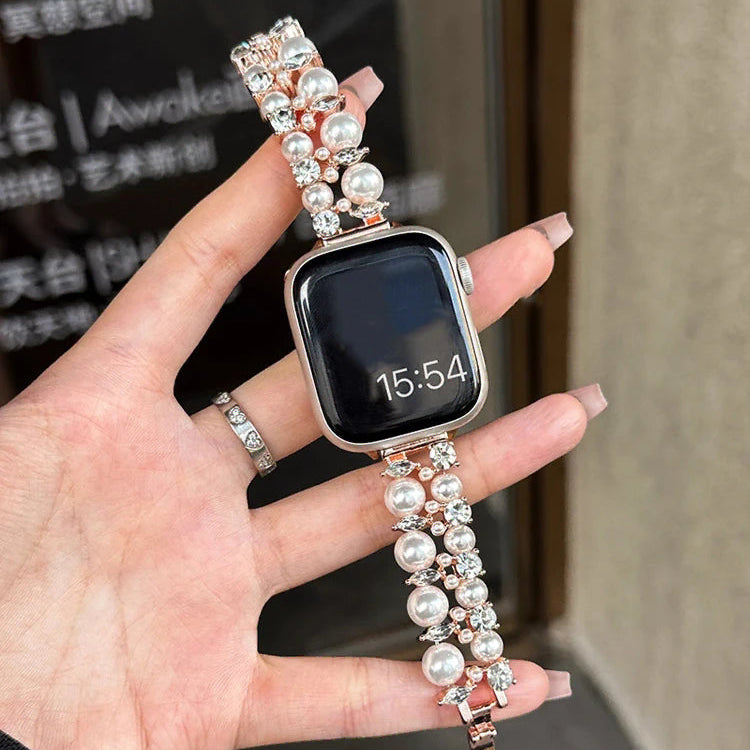 Korvaava ranneke Apple Watchille, jossa on strasseja ja vaaleanpunakultaisia helmiä