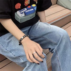 Vintage-tyylinen rannekoru mustilla tähdillä