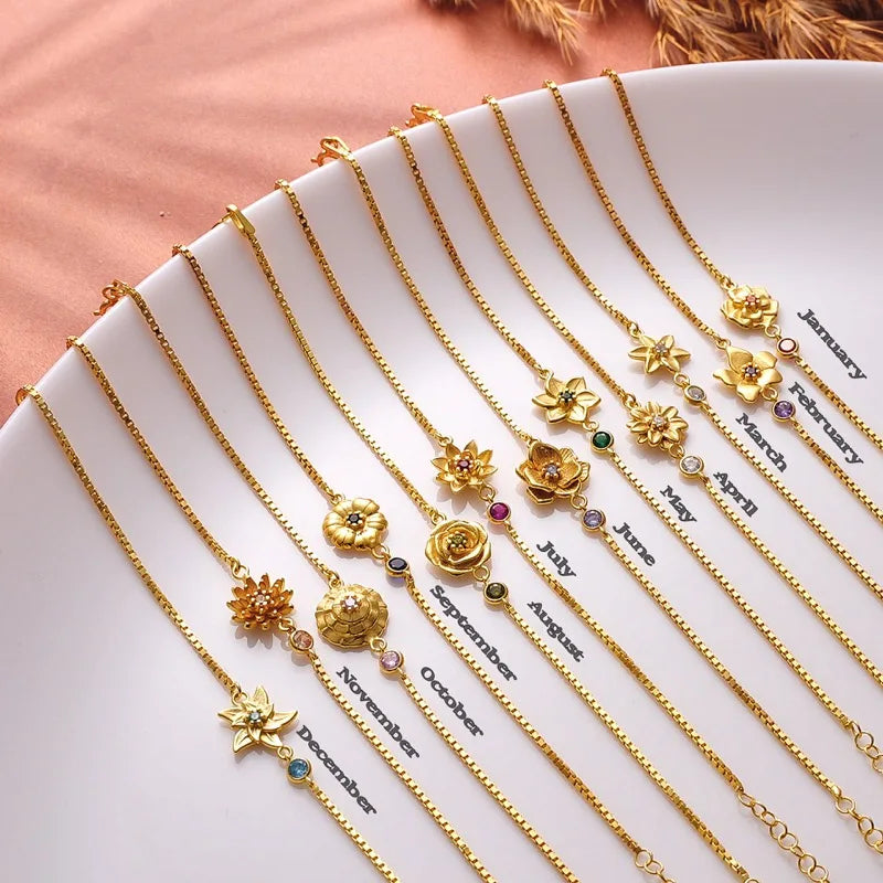 Rannekoru Kukka syntymäkivellä zirkonilla