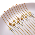 Kukkarannekoru, jossa on syntymäkiven zirkoni 