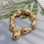 Joustava vesipisaran muotoinen gourmet-rannekoru