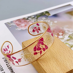 Rannekoru Gourmette Kukka Kirkkaassa Punaisessa Hartsissa a