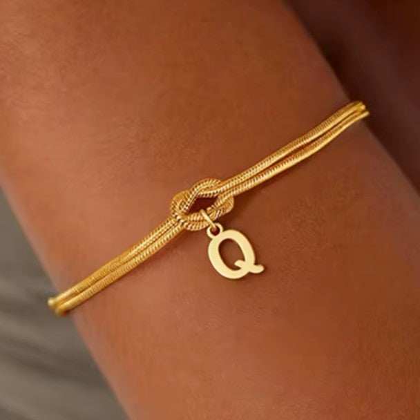 Alkuperäinen rannekoru ja solmu - kirjain 