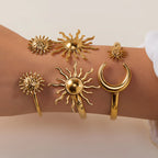 Bracelet ouvert deux soleils martelés