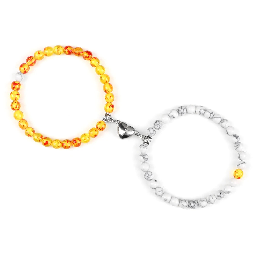 Pariskuntien rannekorut magneettisella helmillä 