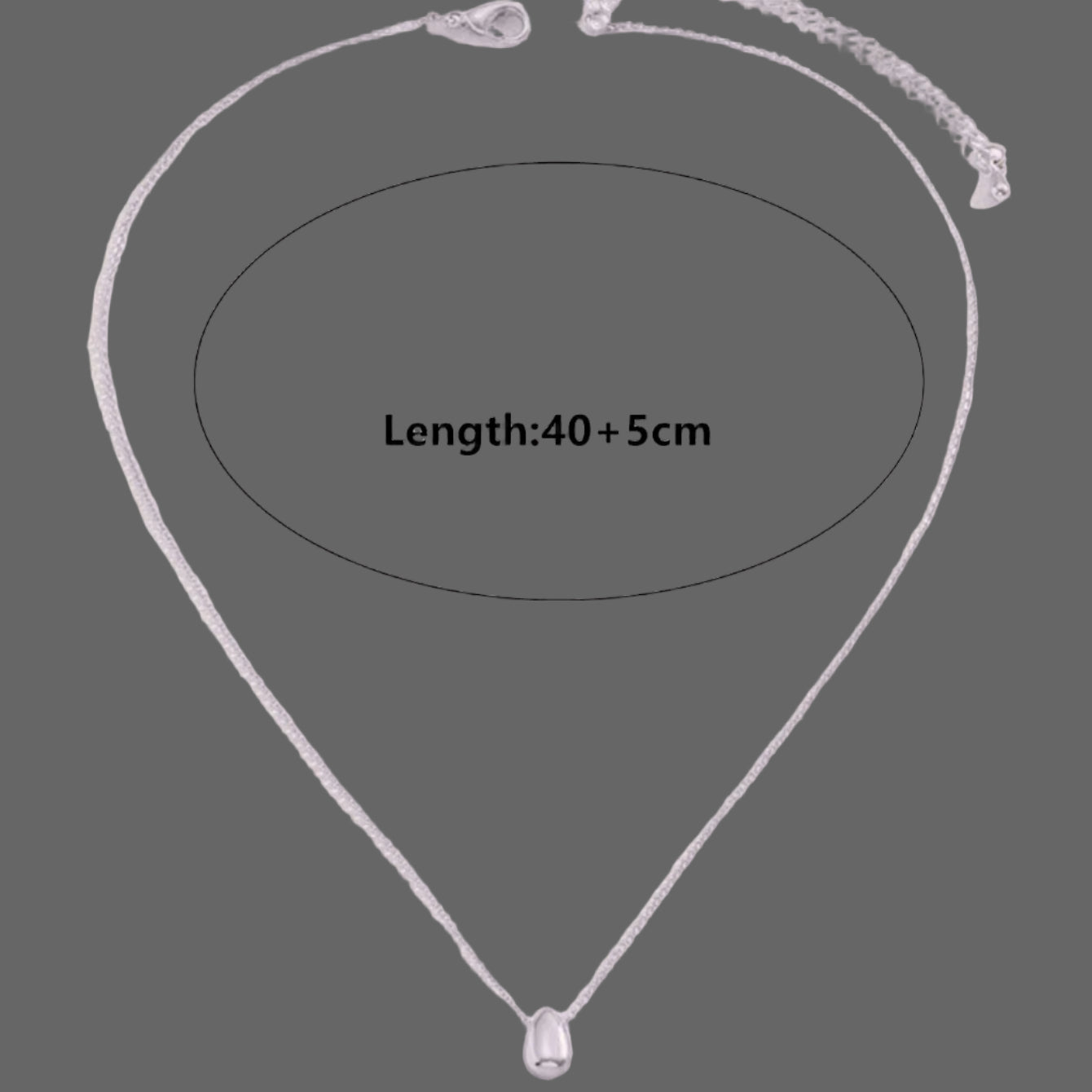 Kaulakoru, jossa on hieno vesipisara-riipus 