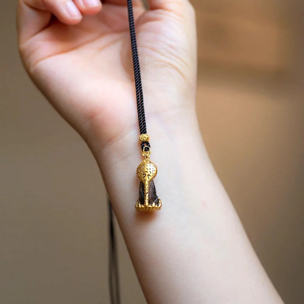 Kaulakoru Tiibetin Buddhan riipuksella