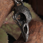 Kaulakoru korppiriipuksella