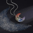 Kaulakoru, jossa on puolikuun riipus ja 7 chakraa