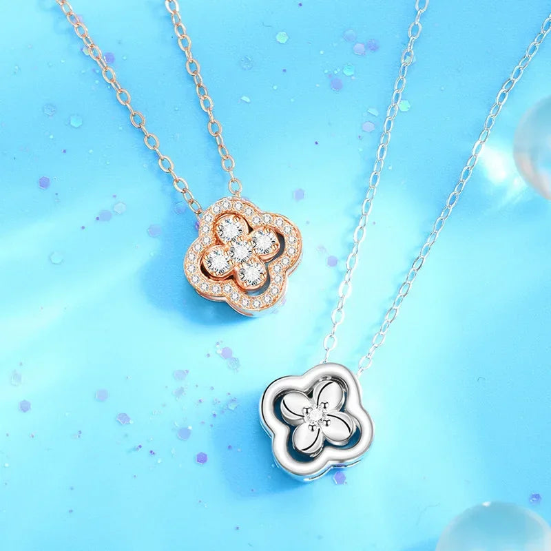 Kaulakoru nelilehtisen apilan riipuksella, jossa on hopeiset zirkonit