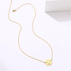 Kaulakoru onnenapilan lehti -riipuksella kulta