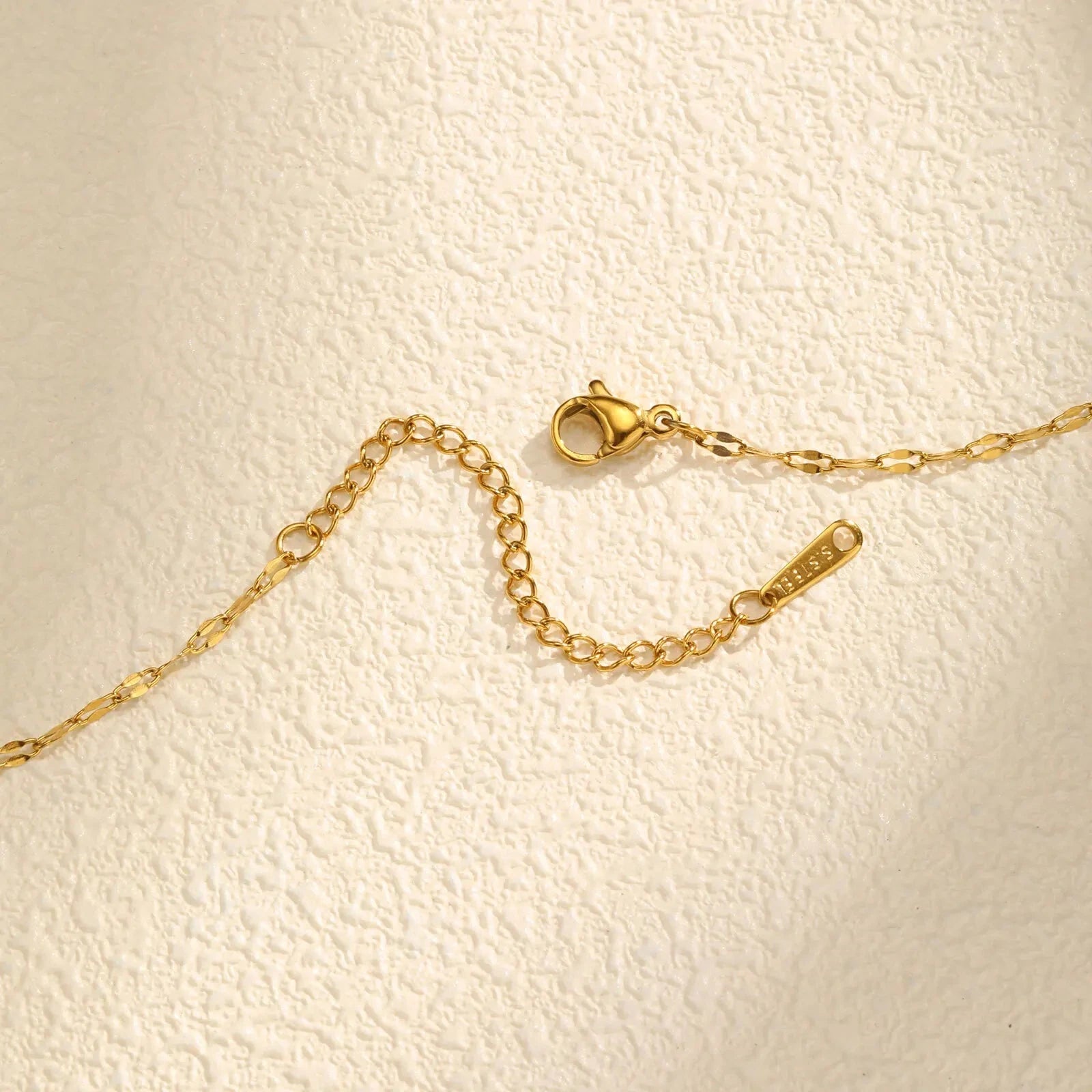 Kaulakoru pyörivällä zirkonikoristeisella kukkariipuksella, stressiä lievittävä