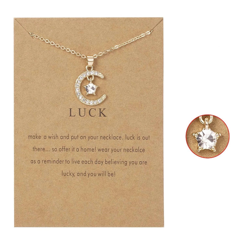 Kaulakoru, jossa on kuun muotoinen riipus ja syntymäkivi strassikoristein