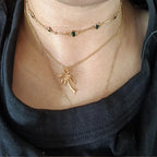 Kaulakoru naisten kultaisella palmupuuriipuksella