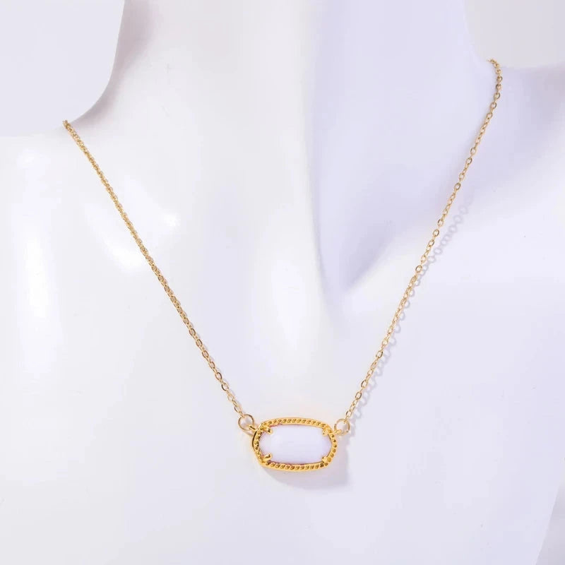 Kaulakoru värillisellä kristalliriipuksella, horoskoopin merkki