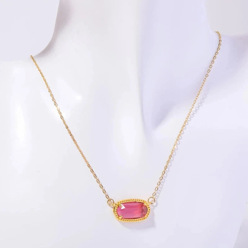 Kaulakoru värillisellä kristalliriipuksella, horoskoopin merkki