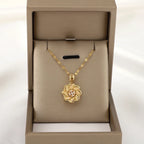 Kaulakoru, jossa pyörivä kukka-anti-stress-riipus