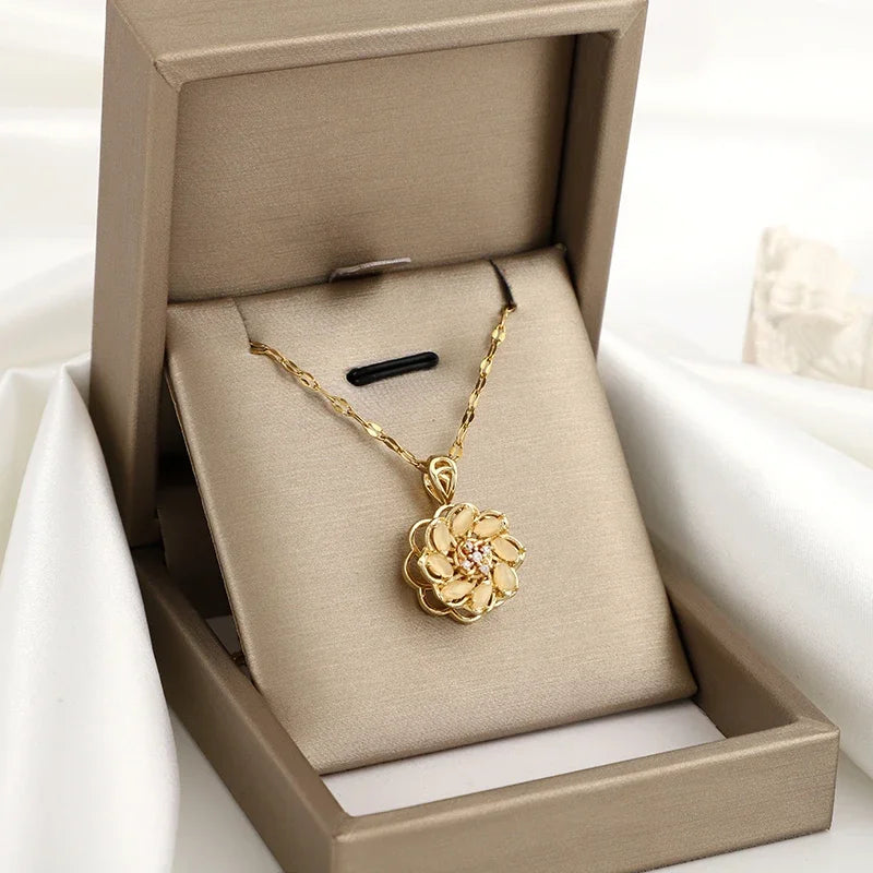 Kaulakoru, jossa pyörivä kukka-anti-stress-riipus