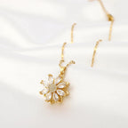 Kaulakoru pyörivällä kukka-anti-stress-riipuksella naisille