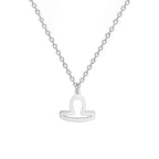 Kaulakoru, jossa on kullanvärinen horoskooppiriipus