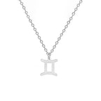 Kaulakoru, jossa on kullanvärinen horoskooppiriipus