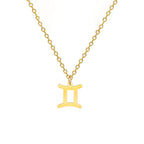 Kaulakoru, jossa on kullanvärinen horoskooppiriipus