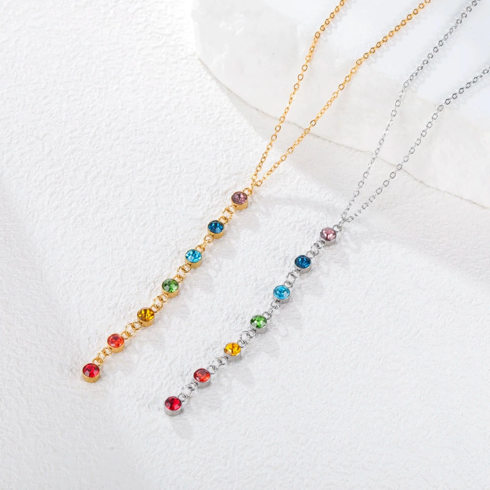 Suojakaulakoru, jossa pitkä riipus ja 7 chakran kiviä hopea