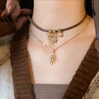 Kaksoisriipus, jossa aurinko