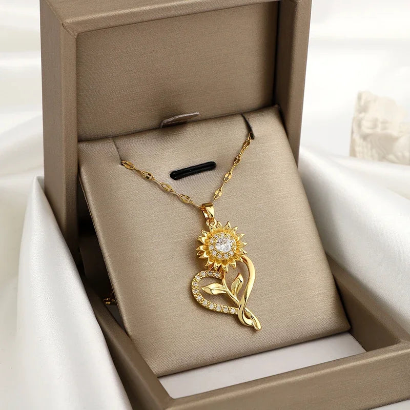 Kaulakoru, jossa on sydän ja pyörivä auringonkukkakukka, stressiä lievittävä