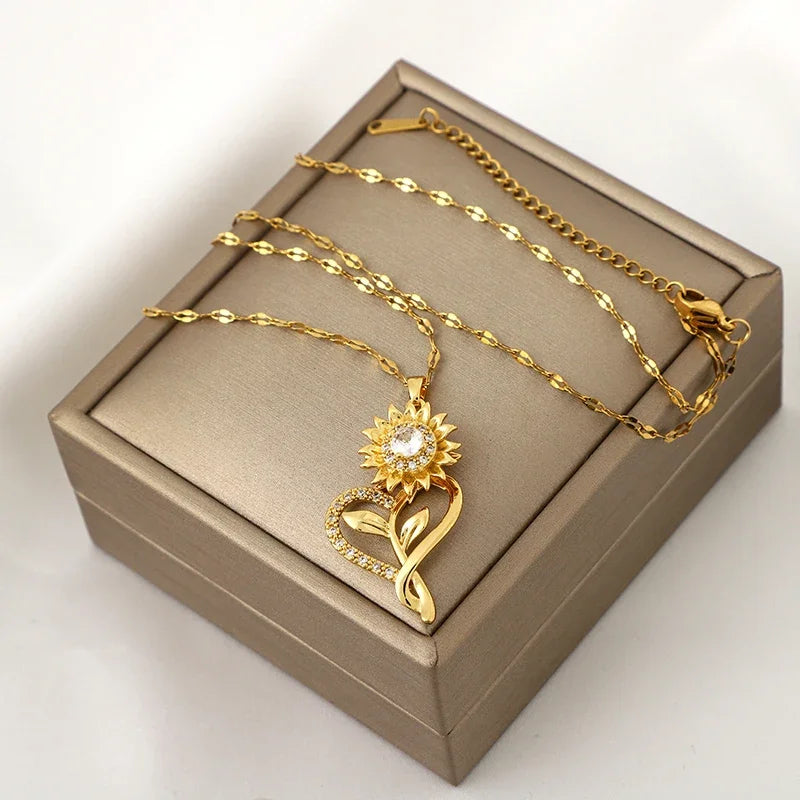 Kaulakoru, jossa on sydän ja pyörivä auringonkukkakukka, stressiä lievittävä
